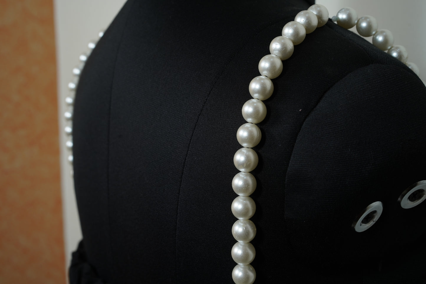 Black top with touch of pearl