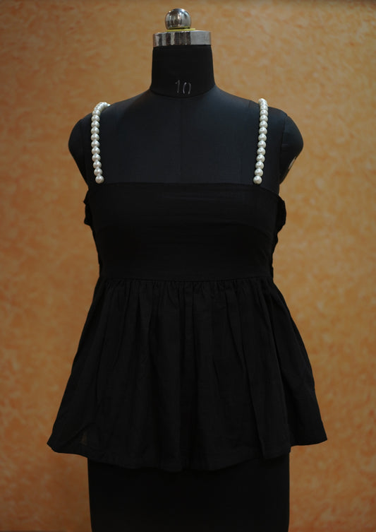 Black top with touch of pearl